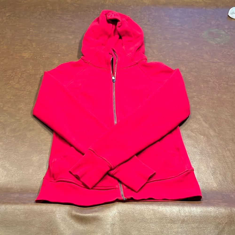 Worn and there is a little stain on the front and the sleeve but you cant tell